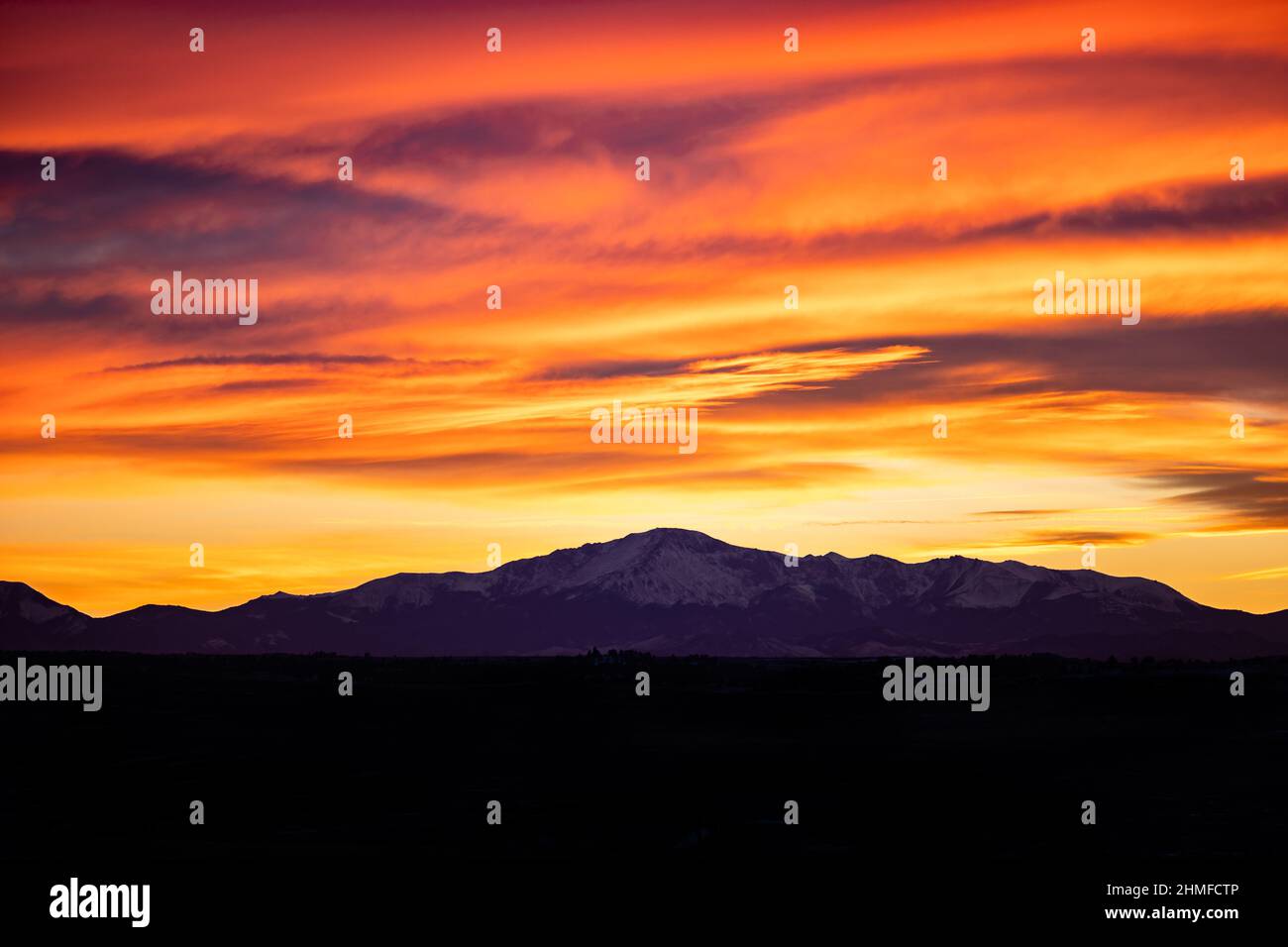 Snow Covered Mountain with Colorful Sunset Stock Photo