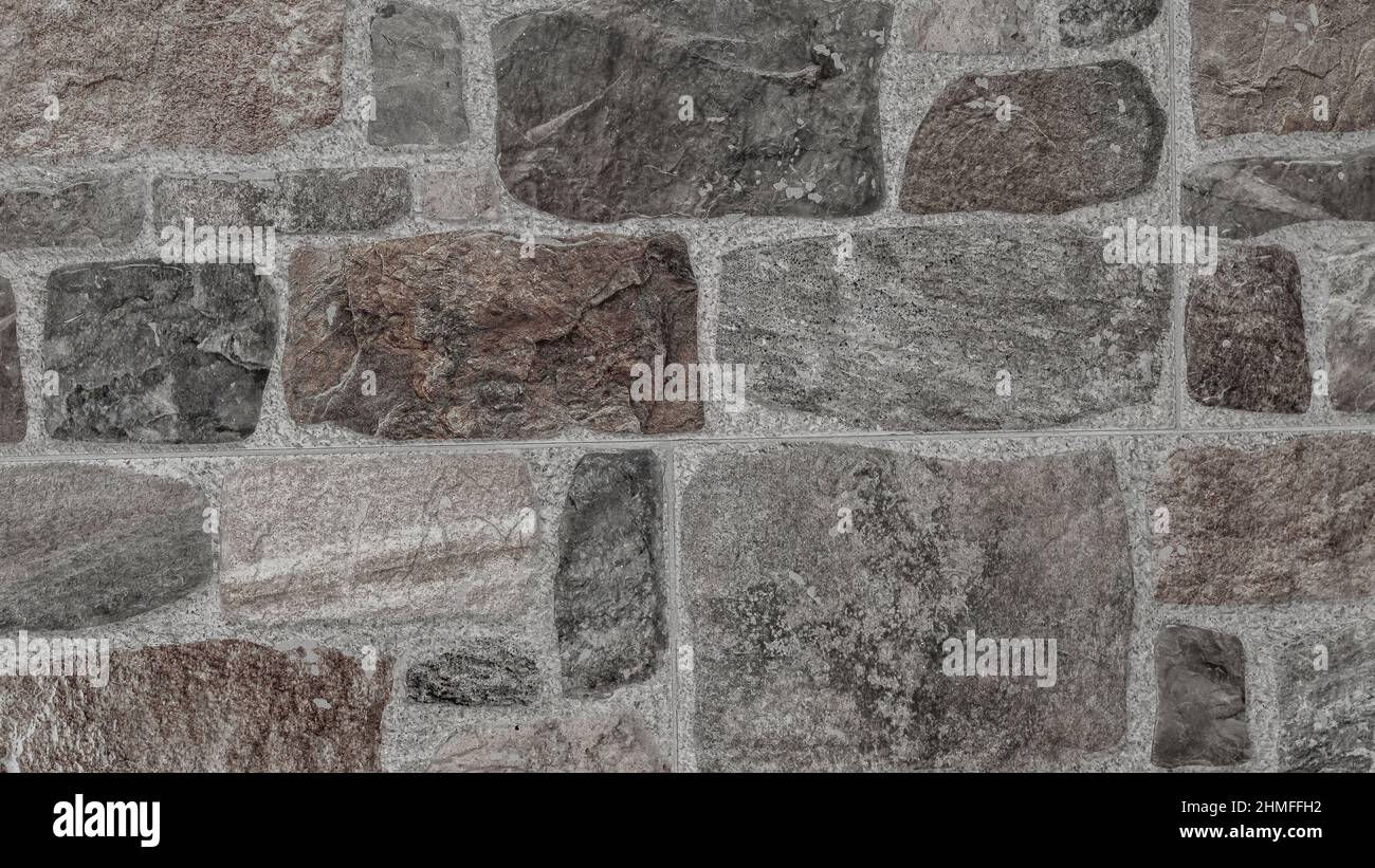 rustic and aged wallstone, exterior wall Stock Photo