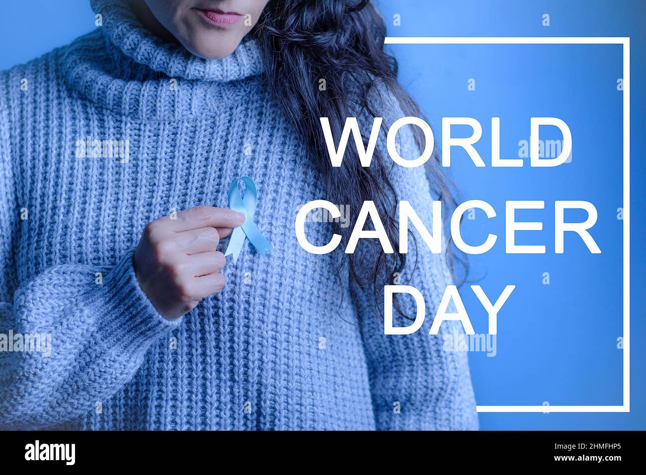 November Prostate Cancer Awareness Month, A Woman's Hands Holding Blue Ribbon in Support of People with Cancer. Prostate cancer and health awareness c Stock Photo
