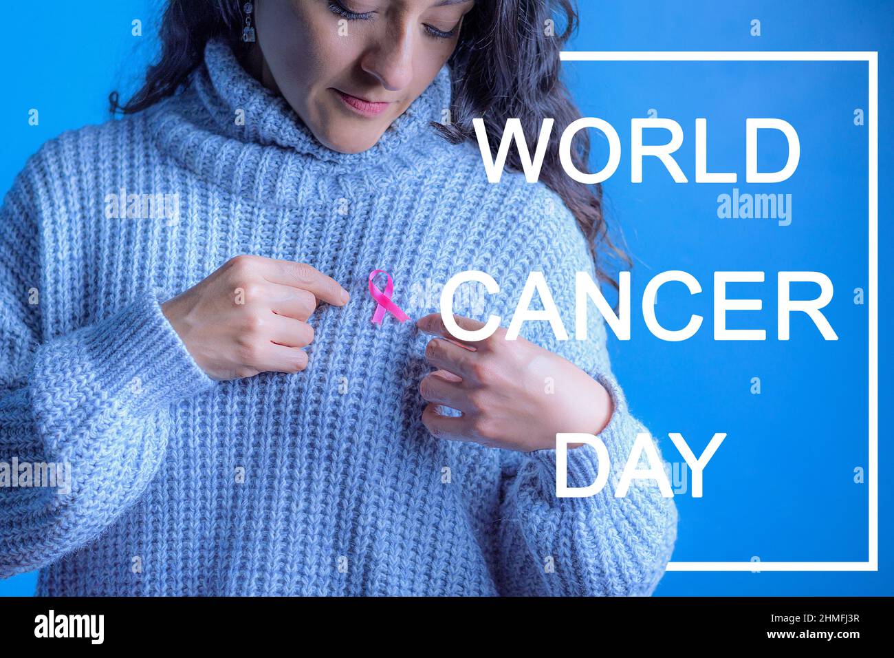 October Breast Cancer Awareness Month, Adult woman holding the Pink Ribbon to support people living with the disease. International Women's Day Concep Stock Photo