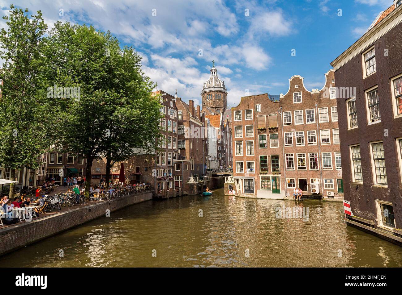 Canal and St. Nicolas Church in Amsterdam in a summer day, Netherlands Stock Photo