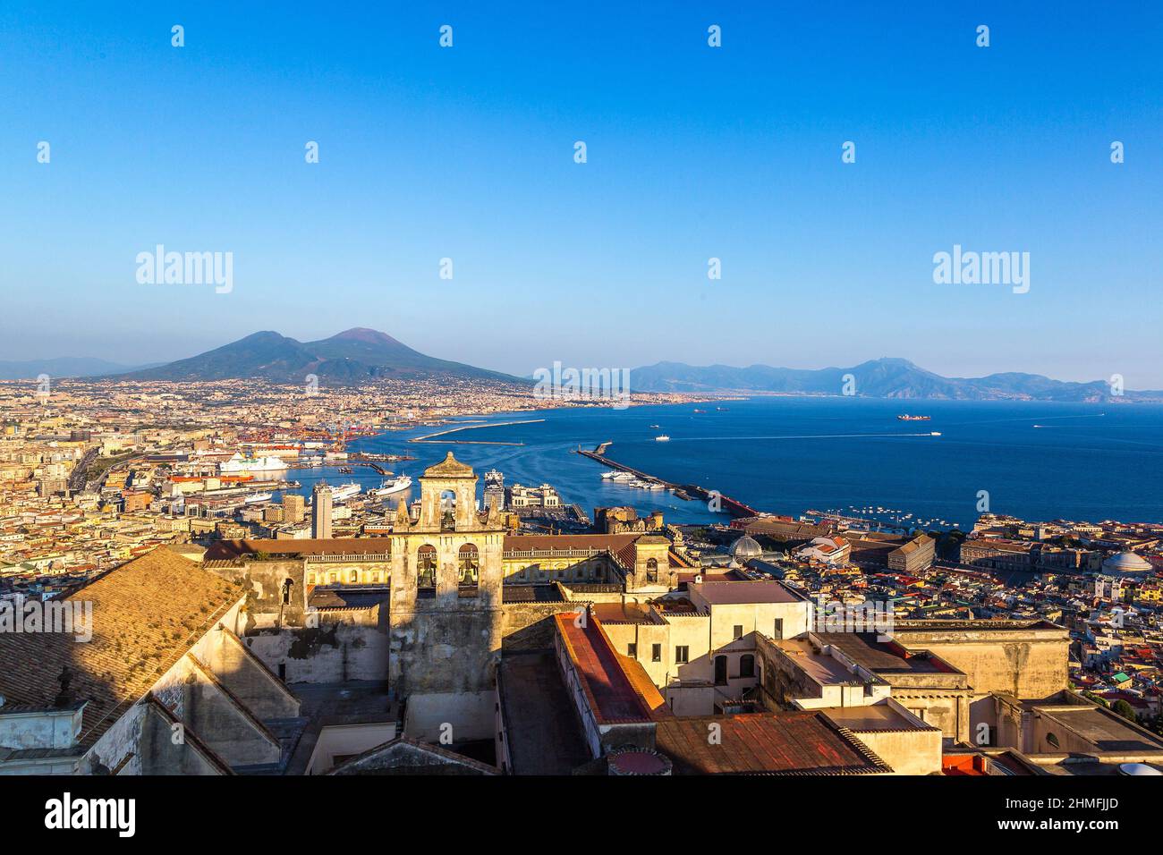 Napoli (Naples) and mount Vesuvius in the background at sunset in a summer day, Italy, Campania Stock Photo