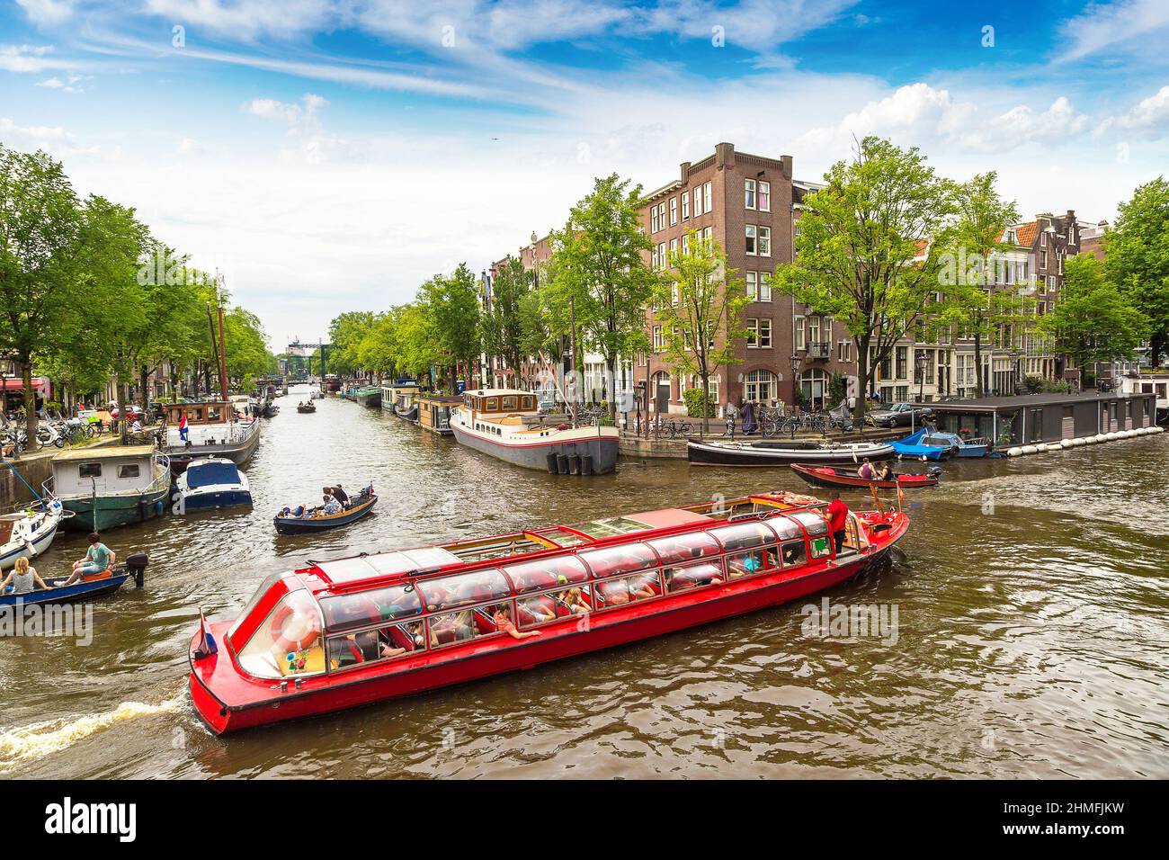 Canal in Amsterdam in a beautiful summer day. Amsterdam is the capital and the most populous city of the Netherlands Stock Photo