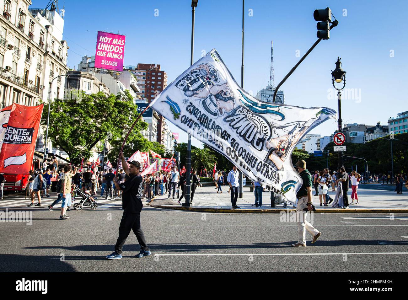 Buenos Aires, Argentina. 08th Feb, 2022. A militant seen carrying a flag of  his group on his way to the Plaza de Mayo, during the demonstration. The  entire political arch of Argentine