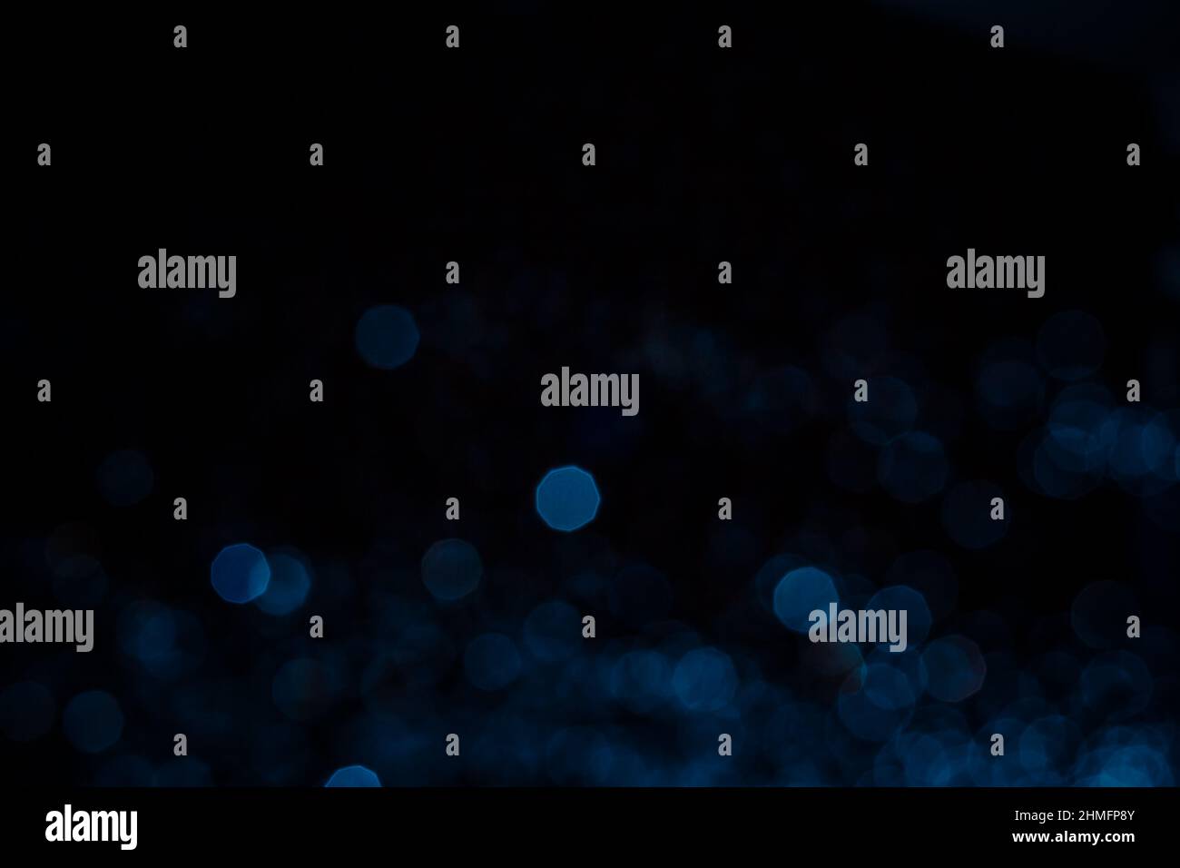 Abstract blue bokeh texture on black background Stock Photo - Alamy