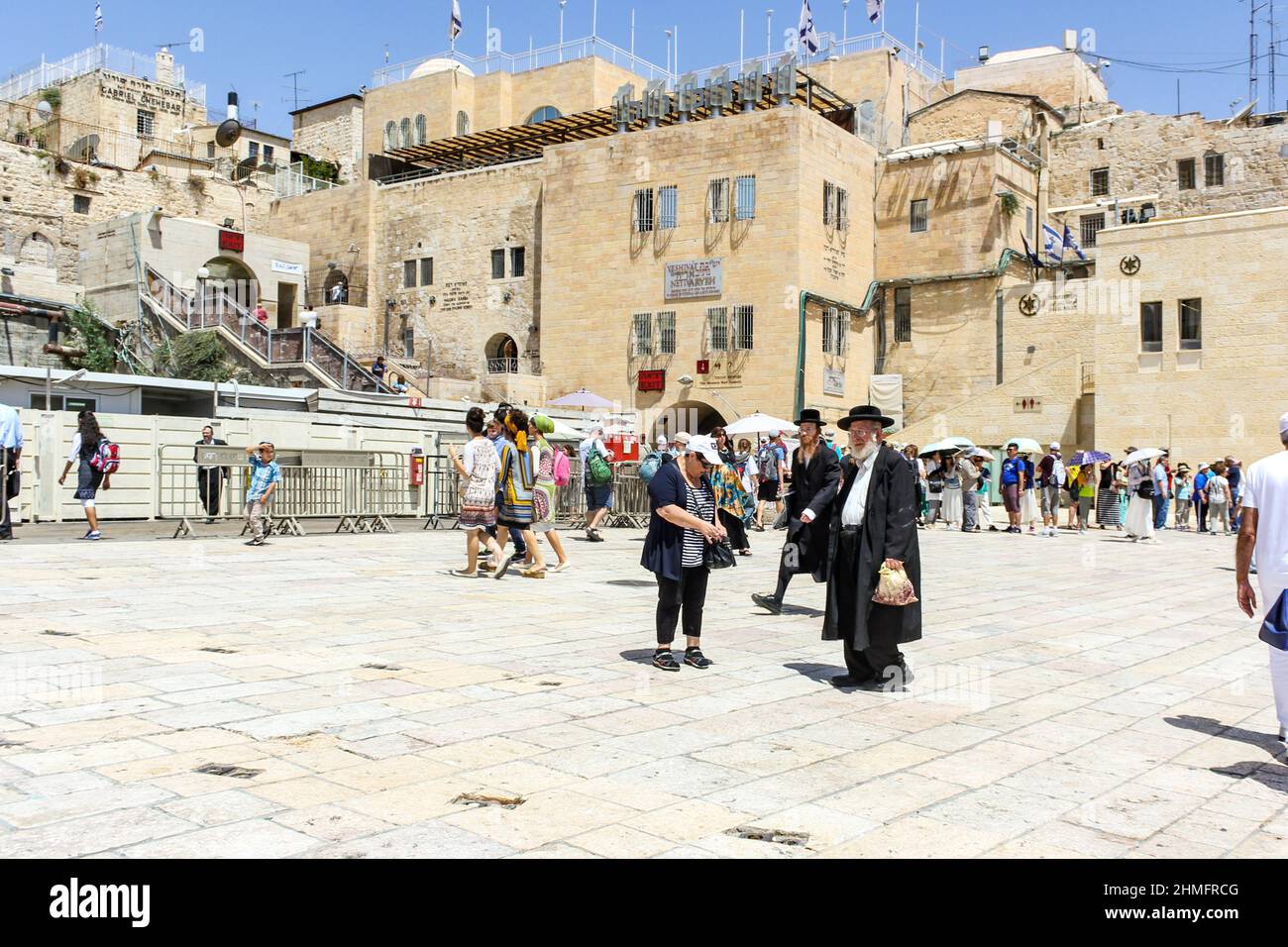 Tourists and locals gather near the entrance to the Western Wall tunnel in Jerusalem, Israel. Stock Photo
