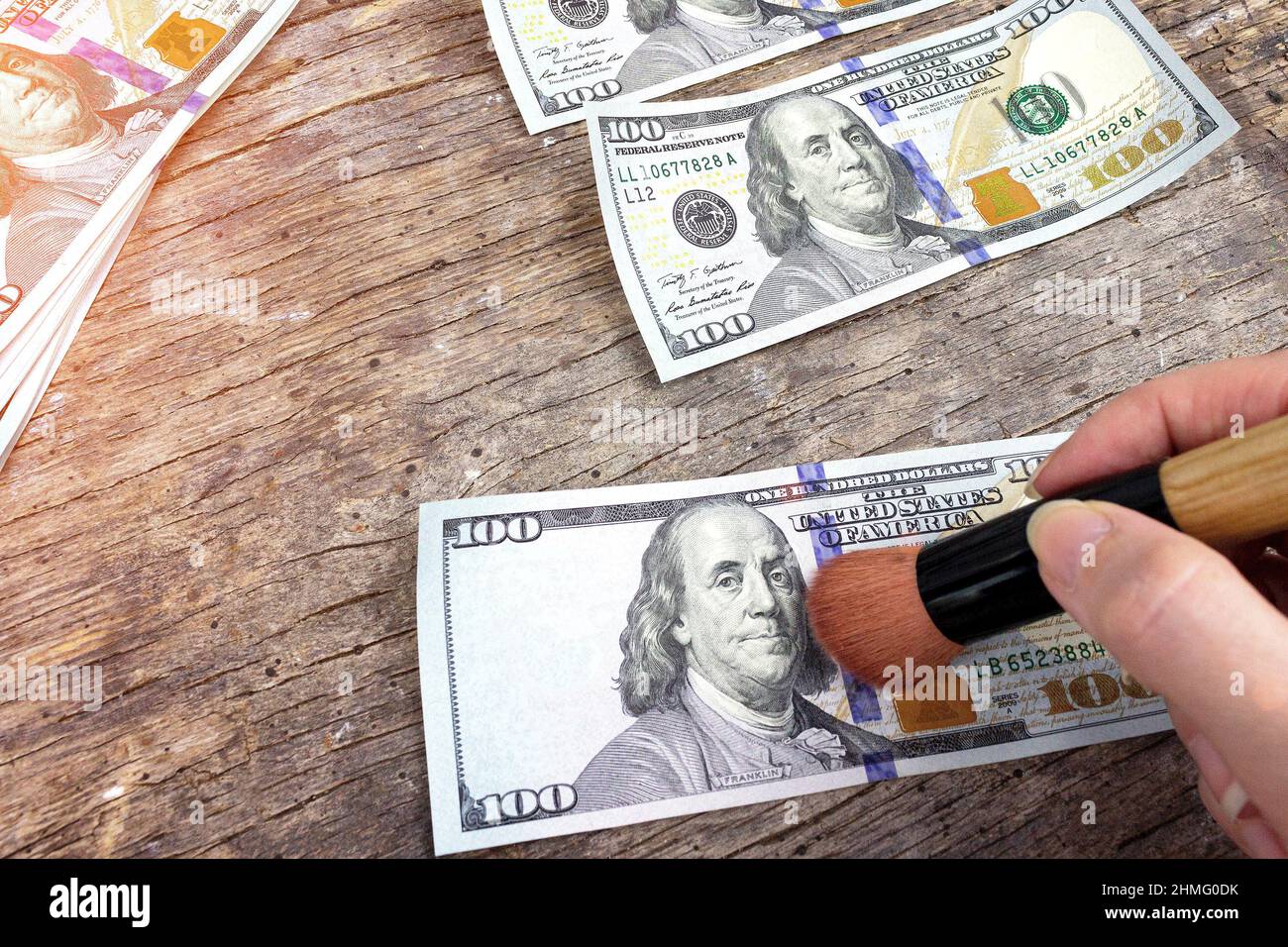 Counterfeiter forges banknotes. New sample money. Illegal production of US dollars Stock Photo