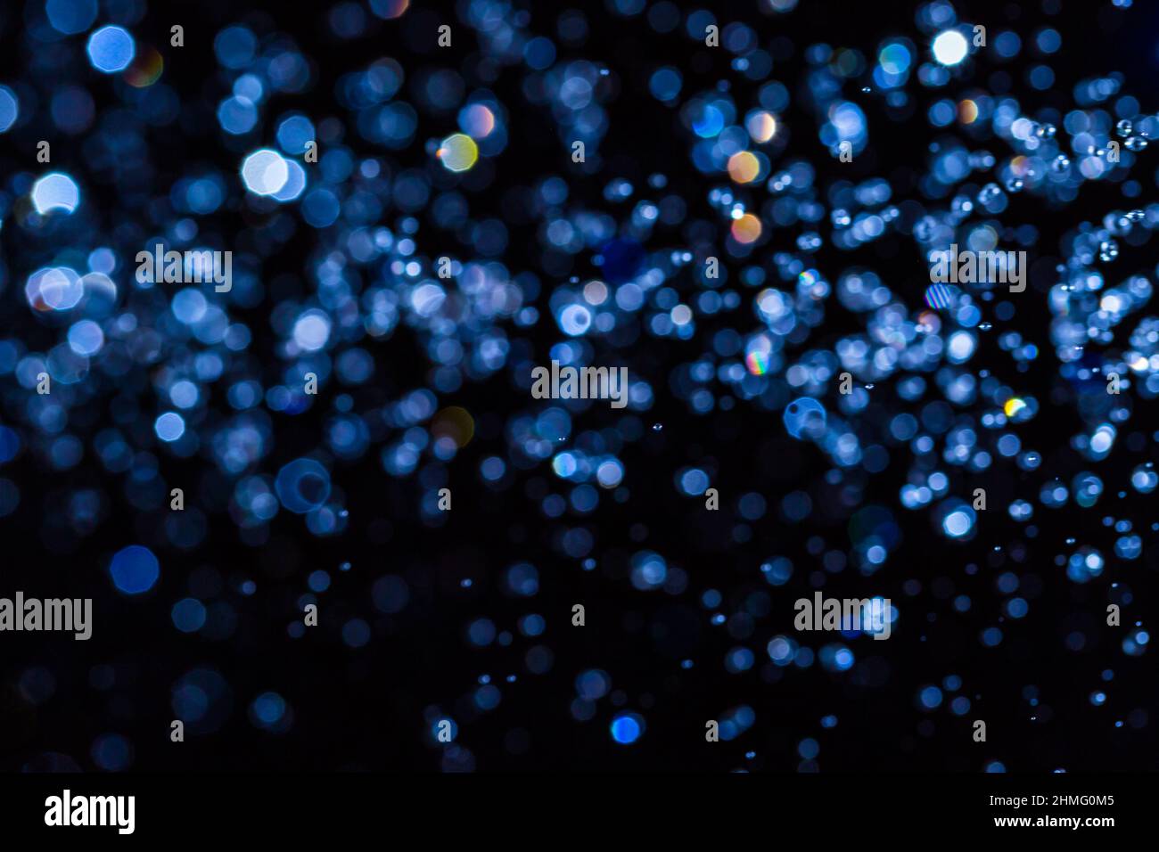 Abstract blue bokeh on black background Stock Photo - Alamy