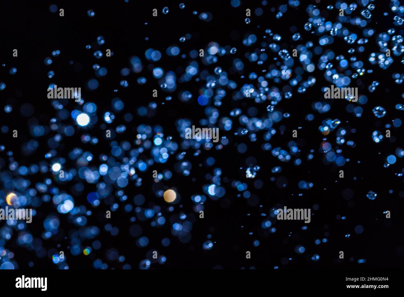 Abstract blue bokeh on black background Stock Photo - Alamy