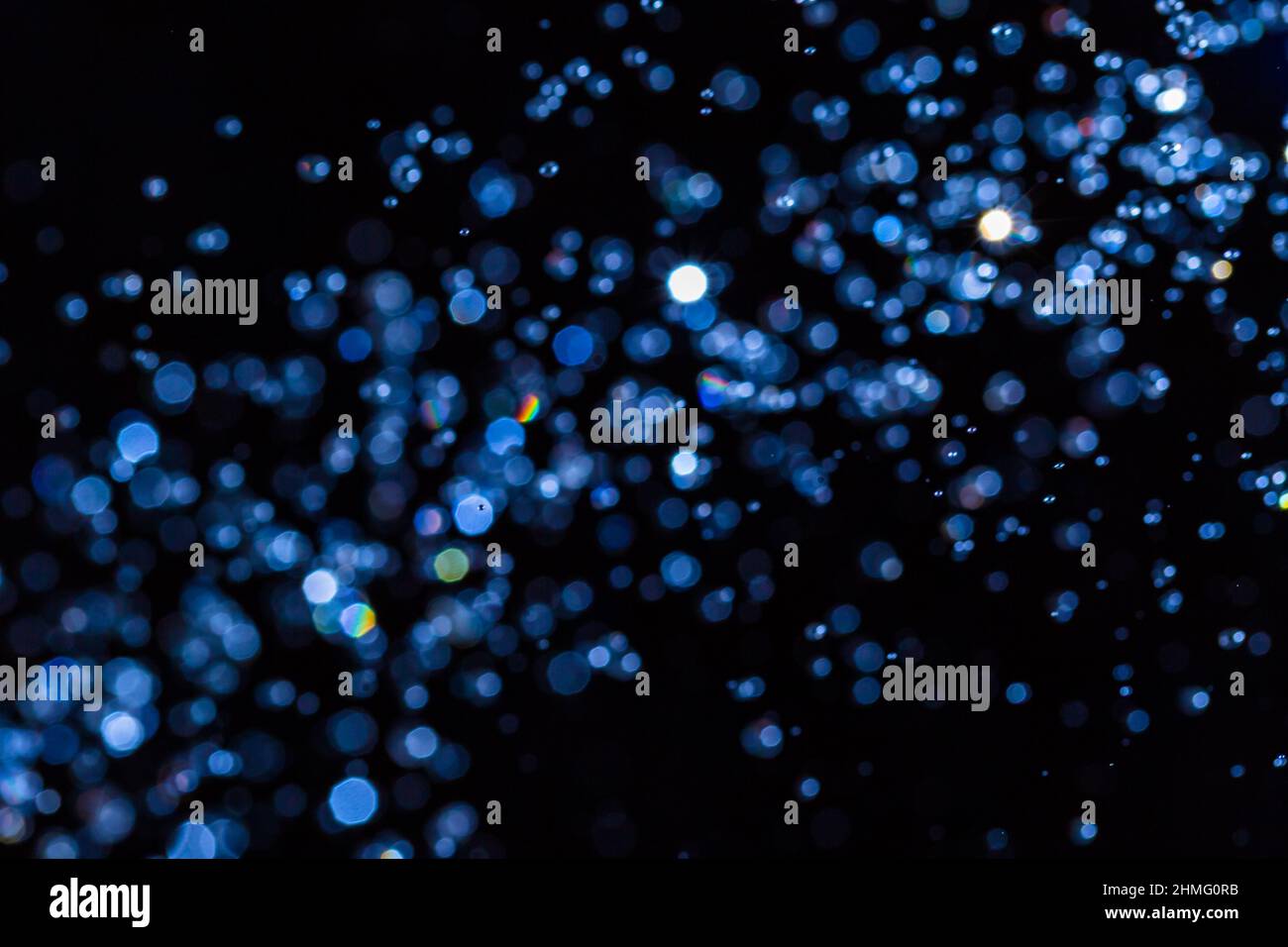 Abstract blue bokeh on black background Stock Photo - Alamy
