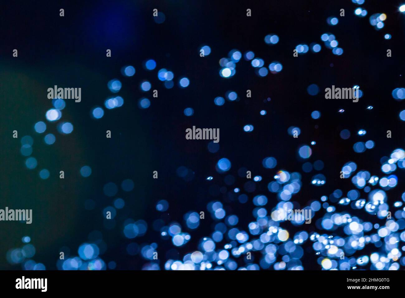 Abstract blue bokeh on black background Stock Photo - Alamy