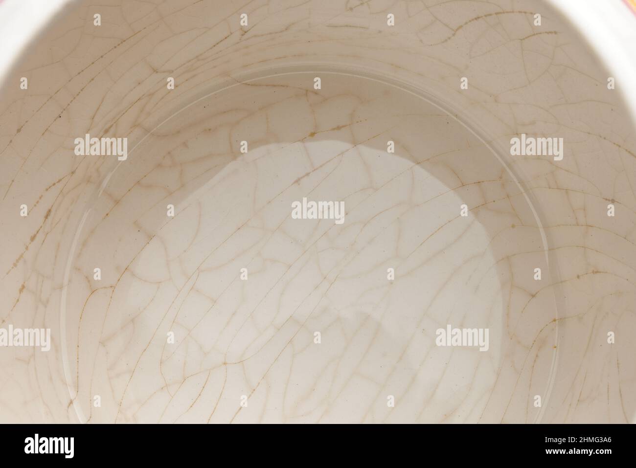 cracked glaze on the bottom of a white ceramic cup Stock Photo Alamy