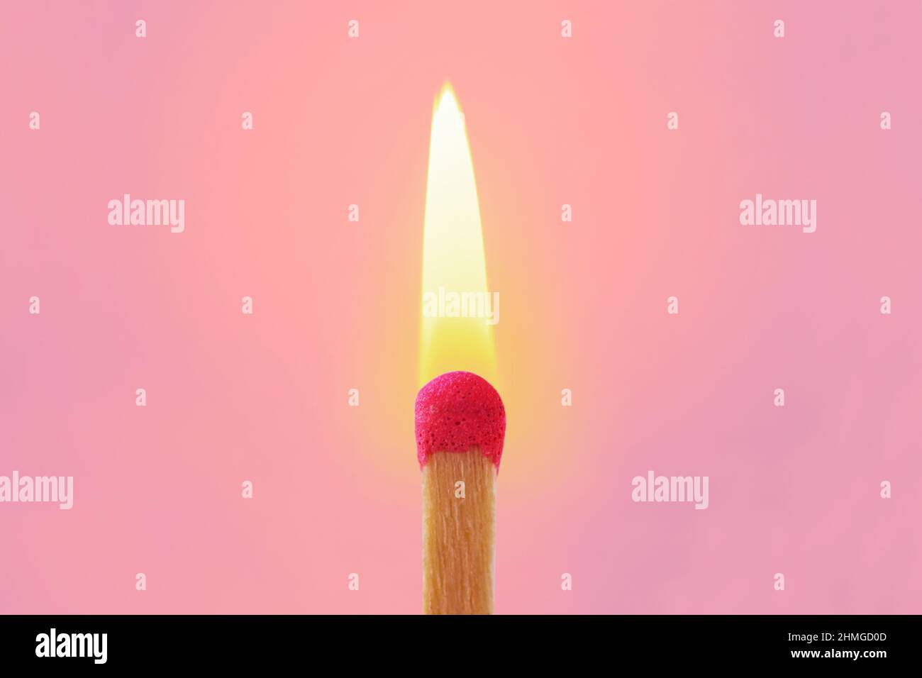 Pink match with flame on pink background - Concept of women and creative thinking Stock Photo