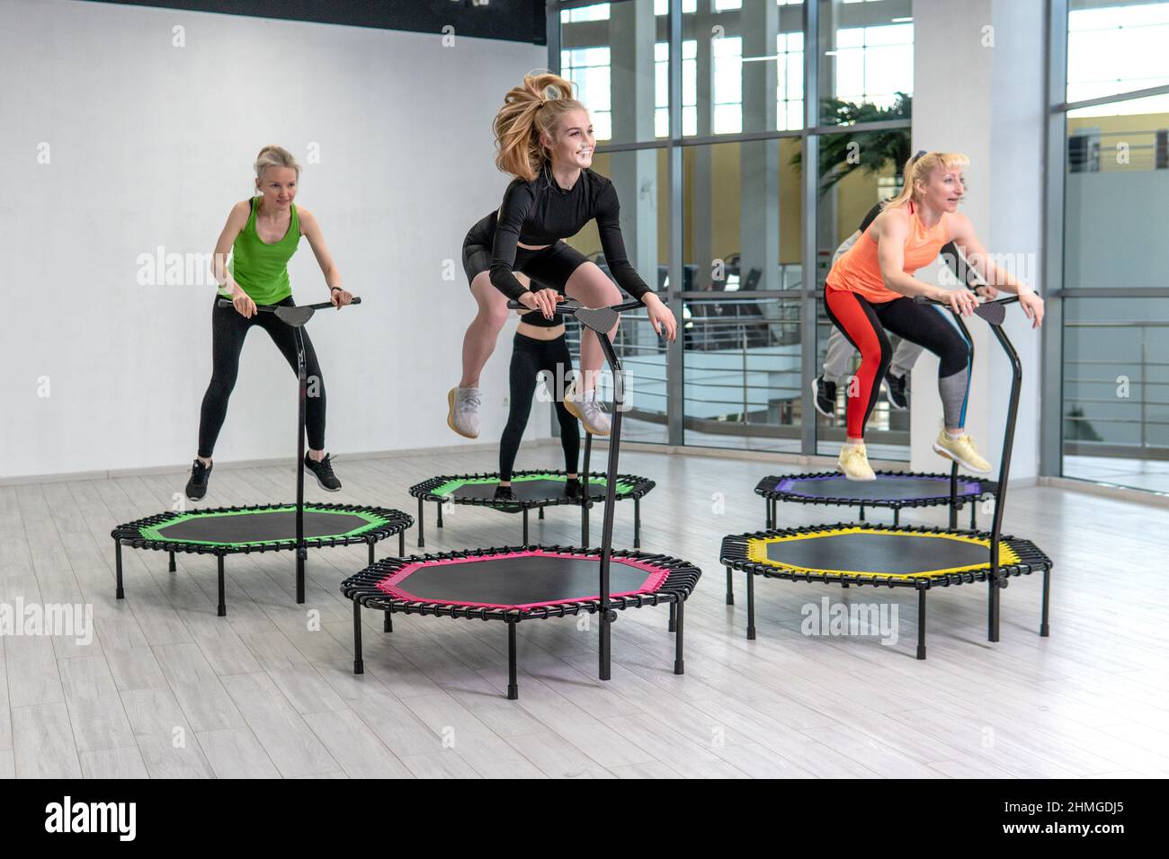 basen Ud Gylden Trampoline for fitness girls are engaged in professional sports, the  concept of a healthy lifestyle jumping trampoline woman fitness gym  healthy, for Stock Photo - Alamy