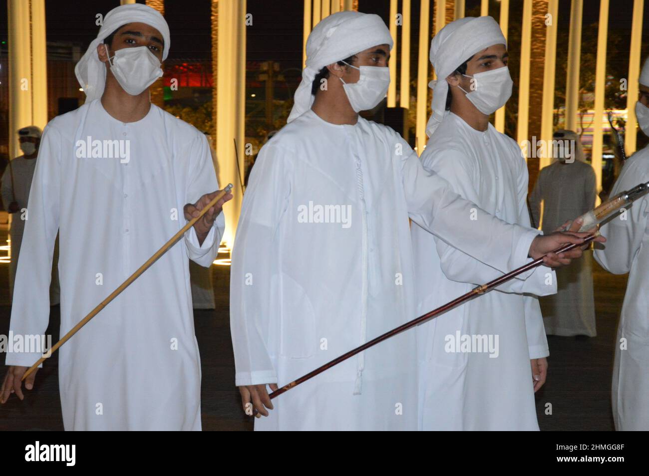 Traditional Arab dancers wearing face masks at Expo 2020 Dubai in
