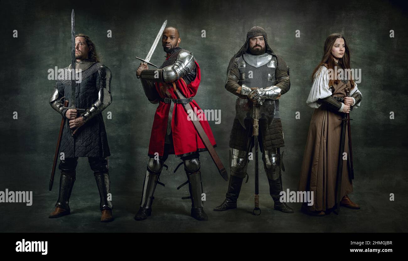 Heroes. Creative art collage with brutal serious medieval warriors or knights in war clothes with wounded faces holding shield, sword isolated over Stock Photo