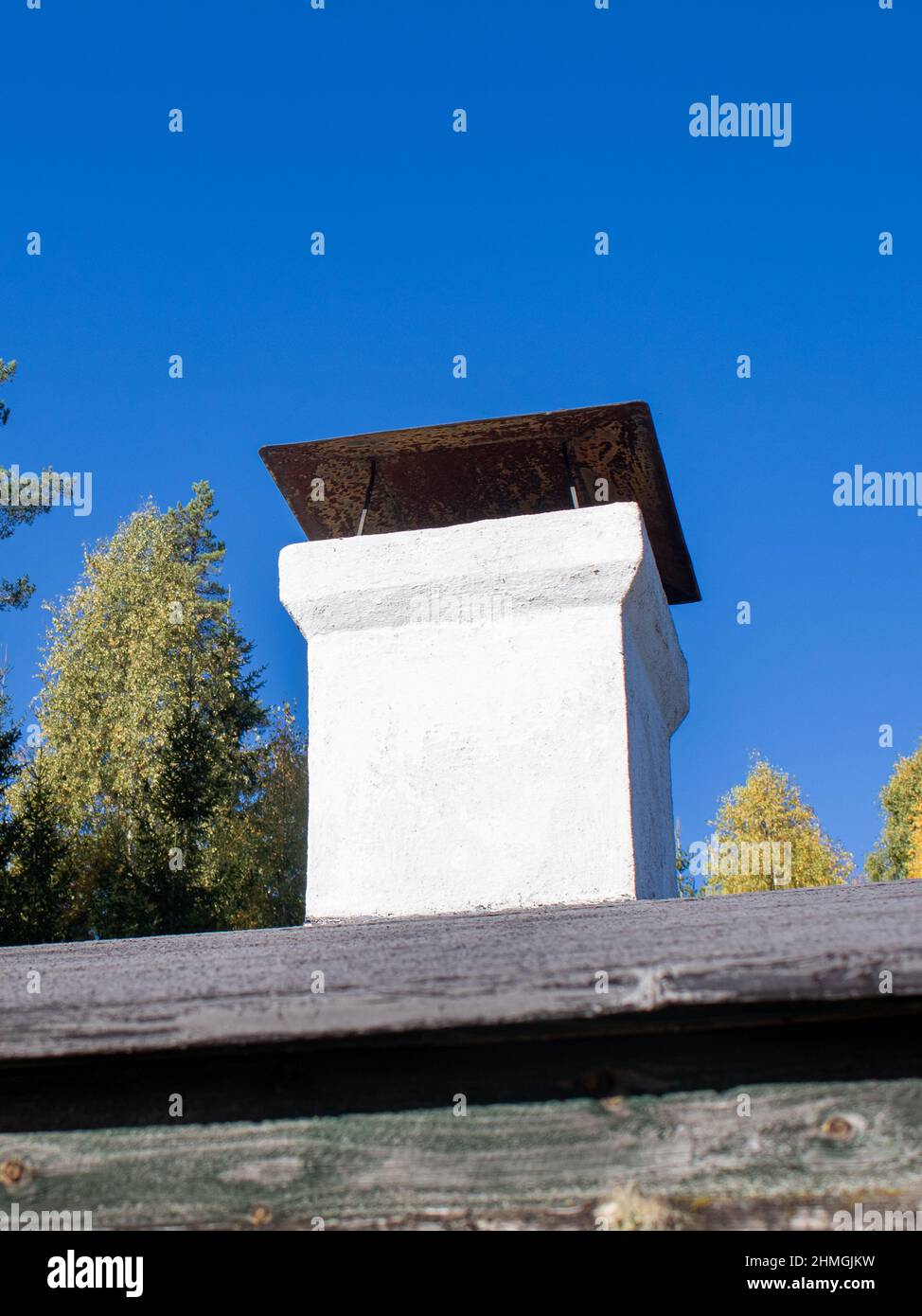 Chimney on the roof of an old summer cottage Stock Photo