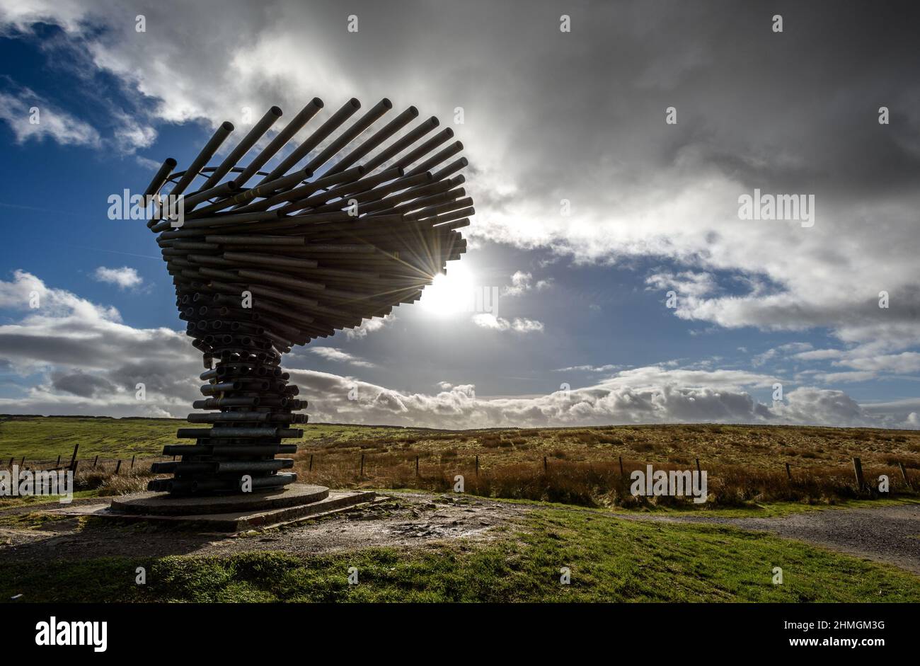 Burnley, Lancashire, UK, Wednesday February 09, 2022. Walkers take a hike along to the Singing Ringing Tree panpoticon over looking the town of Burnle Stock Photo