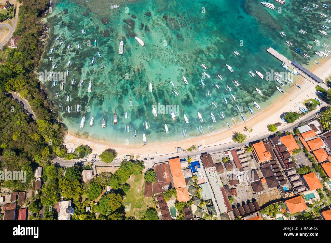 Dramatic aerial view of the Padang Bai village and harbor in east Bali in Indonesia Stock Photo
