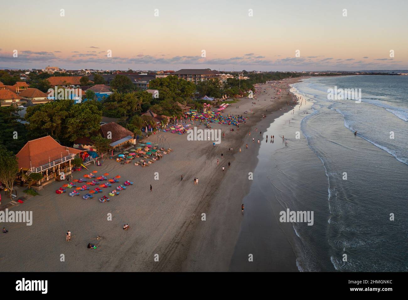 Aerial view of the sunset over the famous Seminyak beach with beach bars in Kuta in south Bali in Indonesia Stock Photo
