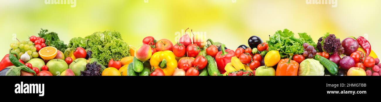 Wide panorama fruits, vegetables, berries for your layout on green blurred background Stock Photo