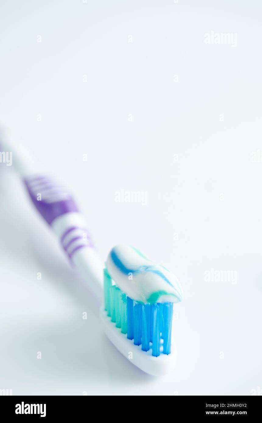 Toothbrush and applied toothpaste on white background Stock Photo Alamy