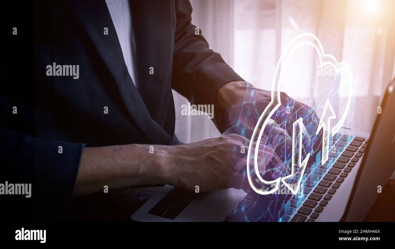Businessman using laptop to store data with cloud computing technology, Cyber Security Data Protection business privacy technology concept. Stock Photo