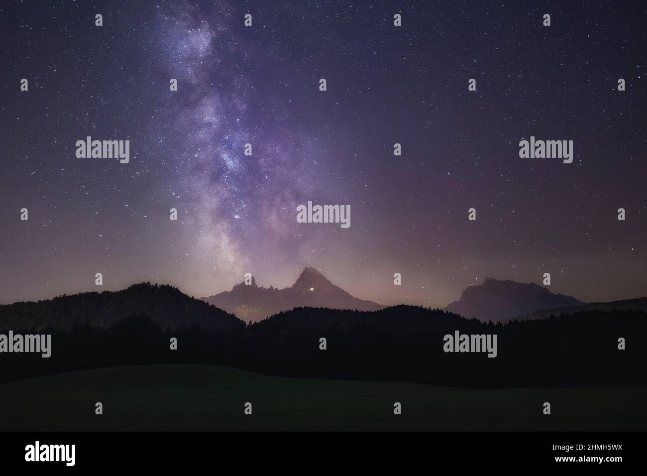The Milky Way is exactly above the Watzmann. Stock Photo