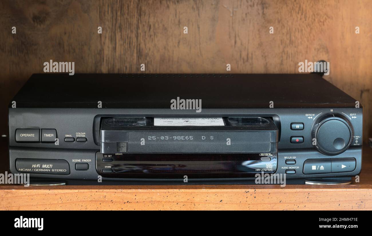 VHS a classic, high quality VHS player/recorder in black with gold lettering. On a brown