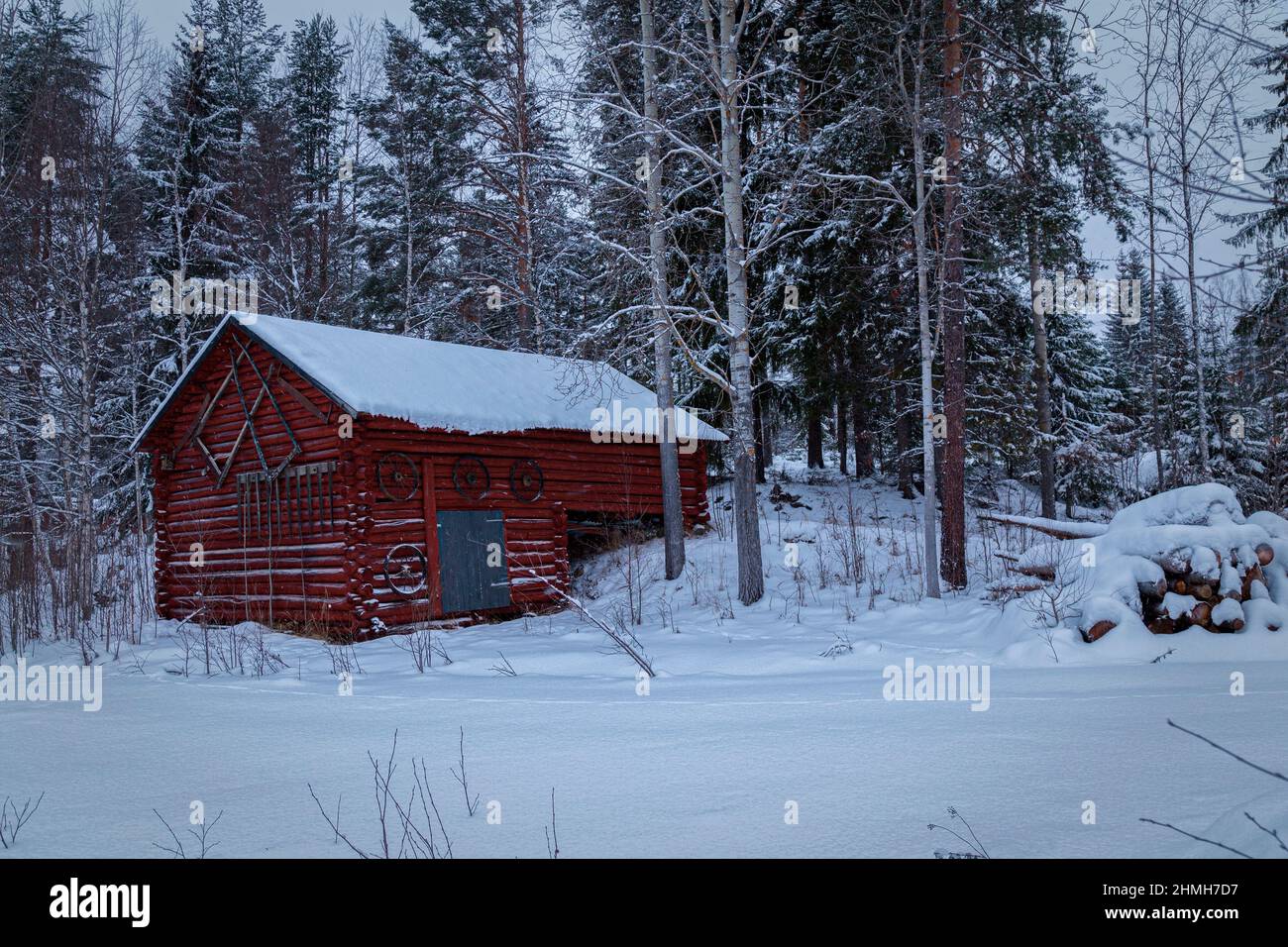 old barn with trees in winter landscape Stock Photo