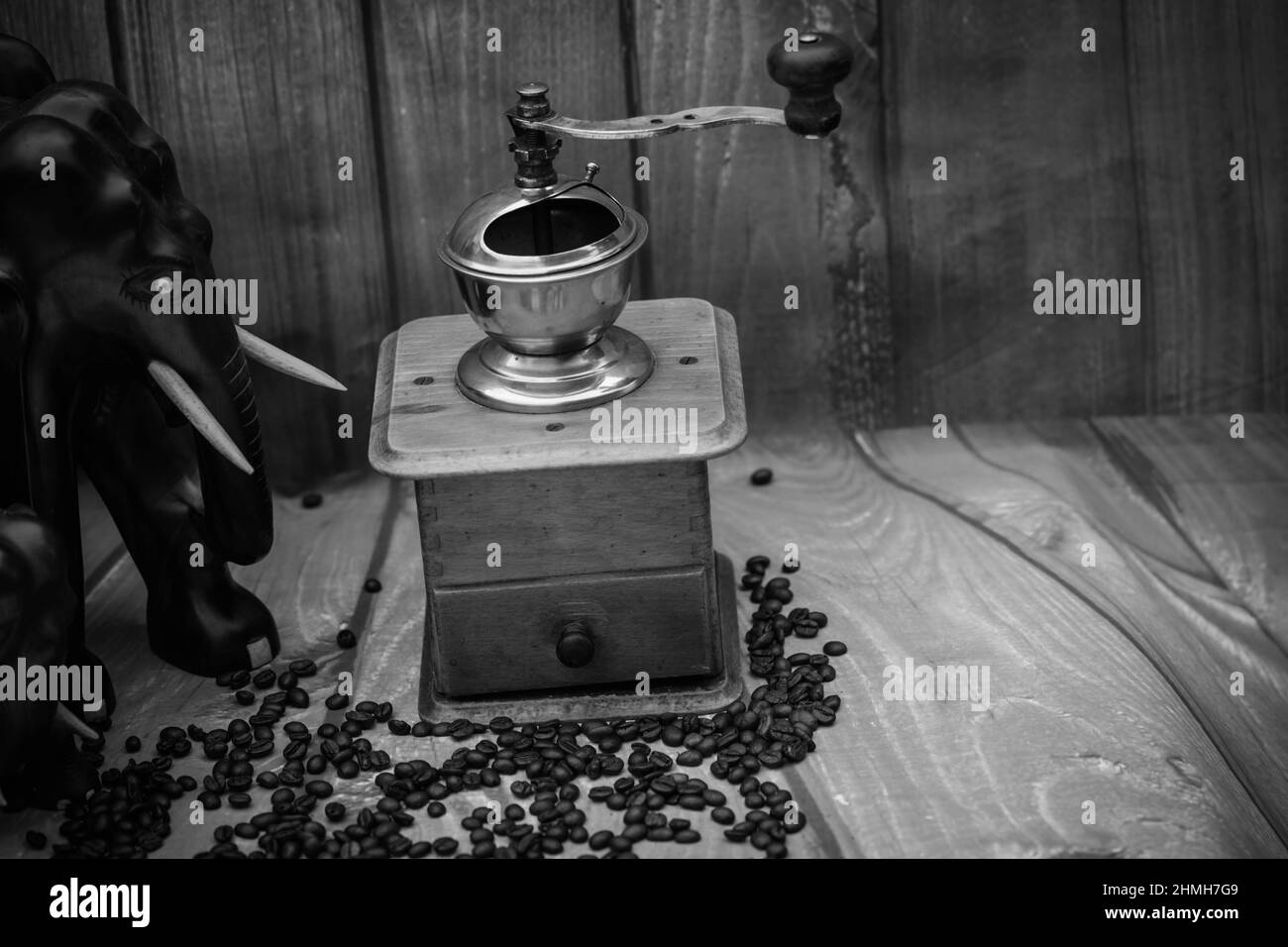 roasted Coffee beans and a vintage coffee grinder Stock Photo Alamy