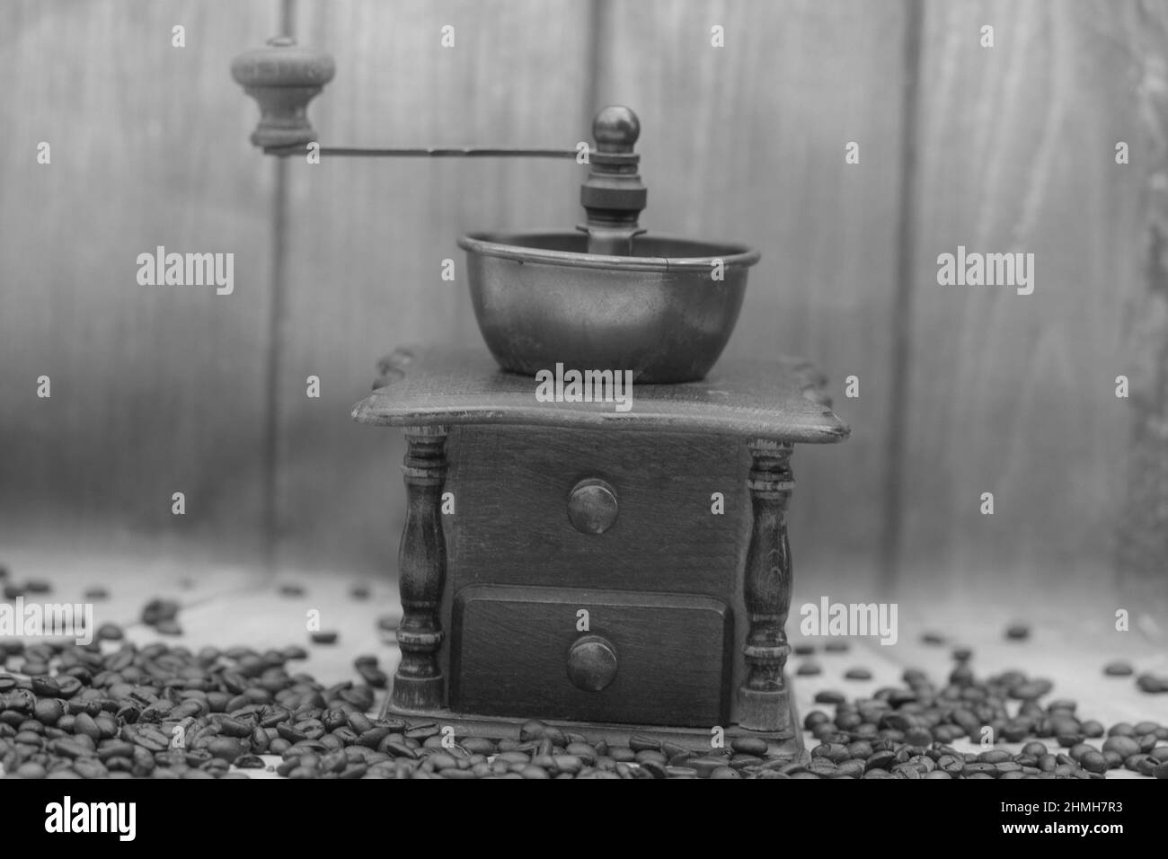 roasted Coffee beans and a vintage coffee grinder Stock Photo Alamy