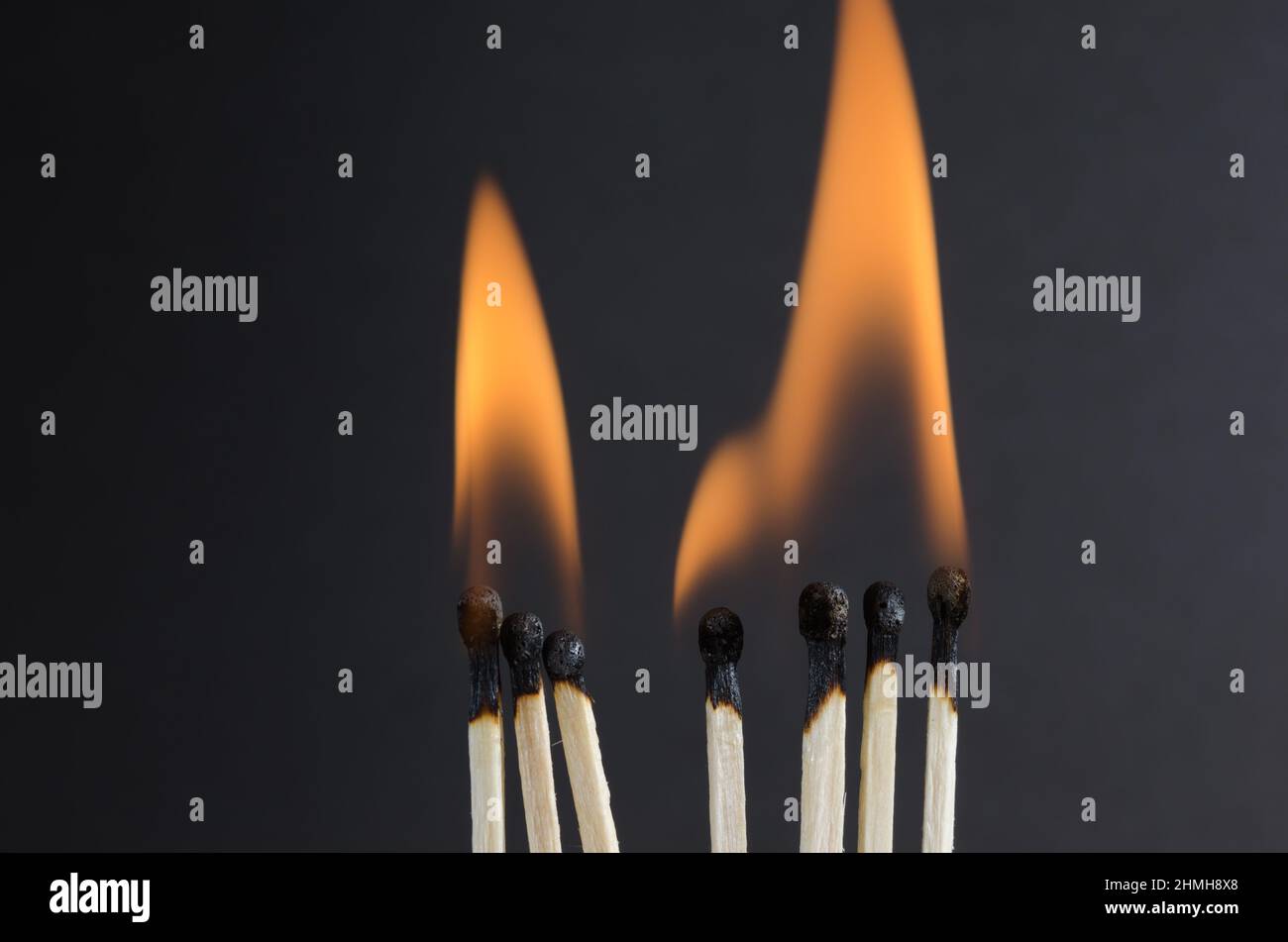 Burning matches with orange flames on a black background Stock Photo ...