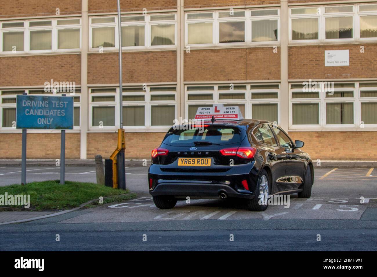 DVSA Driving Test Candidates Only sign,  2019 black Ford Focus 6 speed manual car learner drivers taking their proficiency test in Southport, Merseyside, UK Stock Photo
