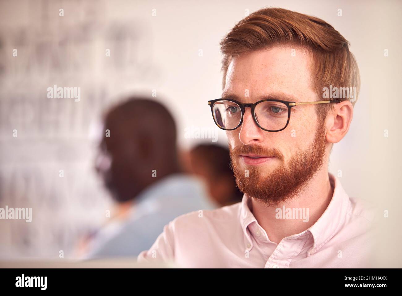 Businessman With Laptop Working On Table In Office Coffee Shop Stock Photo