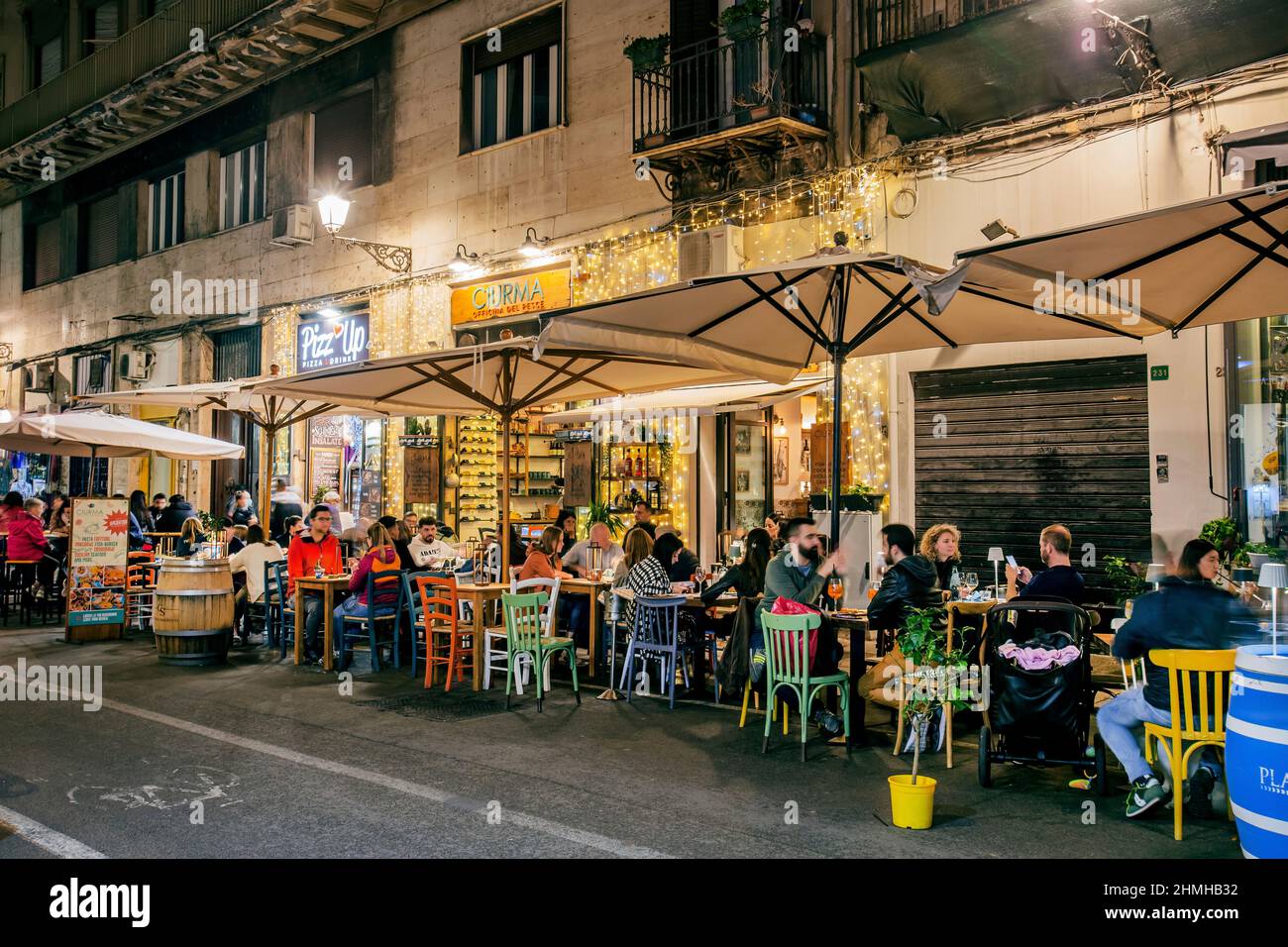 Restaurant terrace on Via Maqueda in the old town at night, Palermo, Sicily, Italy Stock Photo