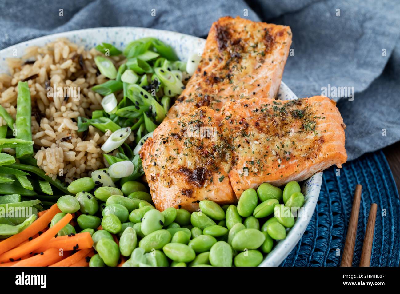 Close up view of salmon fillets in an Asian salmon salad bowl. Stock Photo