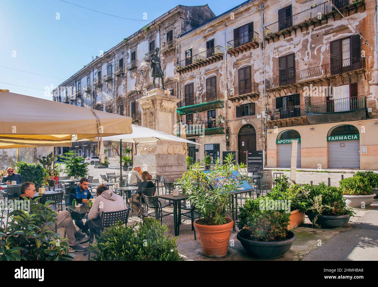 Sidewalk cafe in the Piazza Bologni with monument Carlo V, Palermo, Sicily, Italy Stock Photo