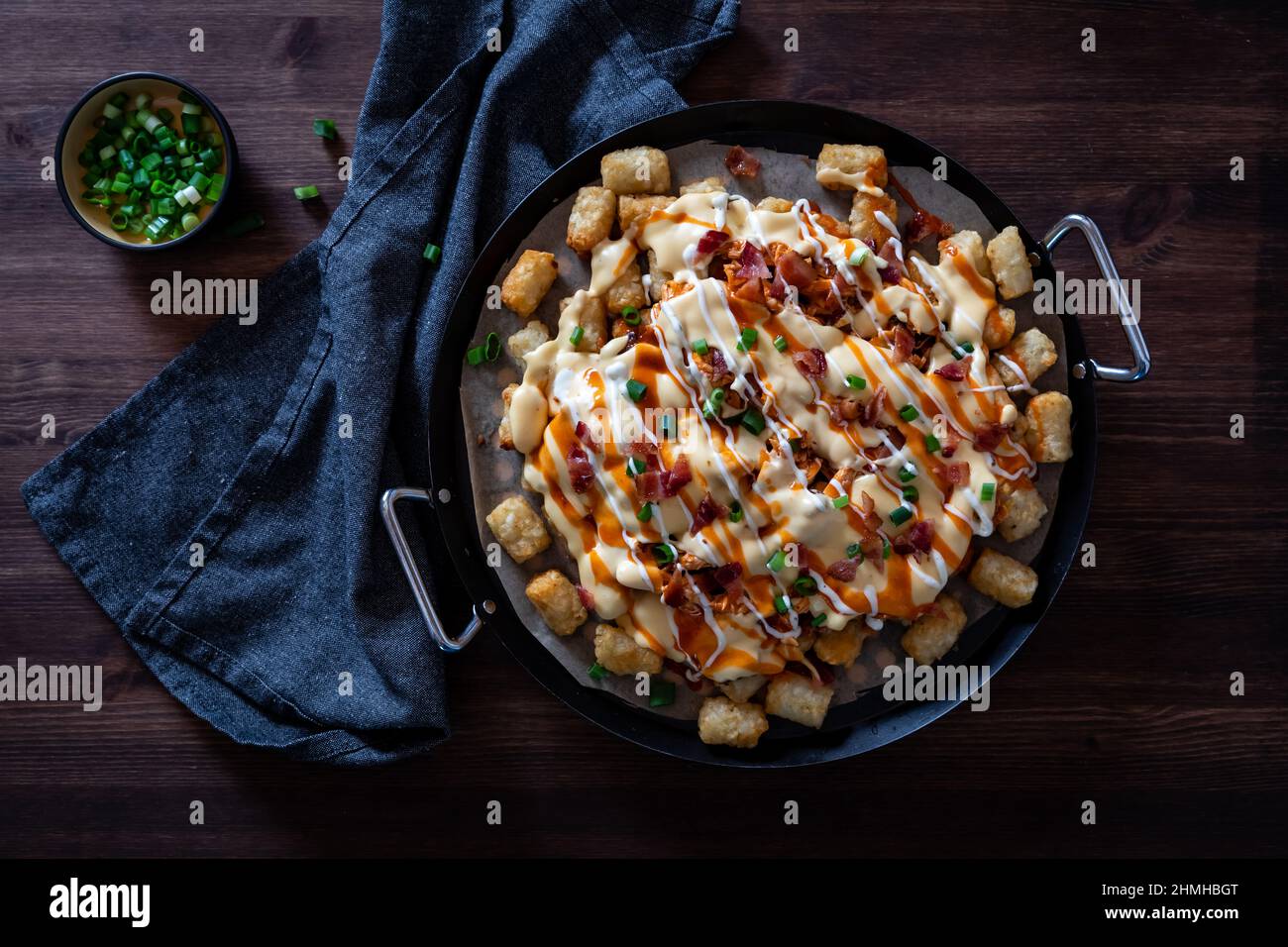 Top down view of tater tot poutine fresh out of the oven, ready for sharing. Stock Photo