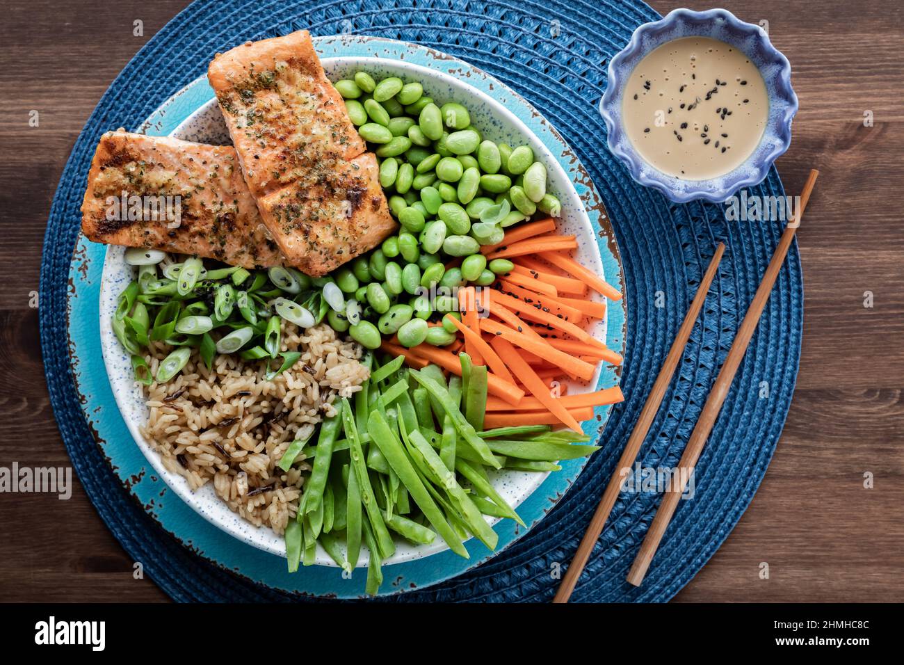 Top down view of a freshly made Asian salmon salad bowl, ready for eating. Stock Photo