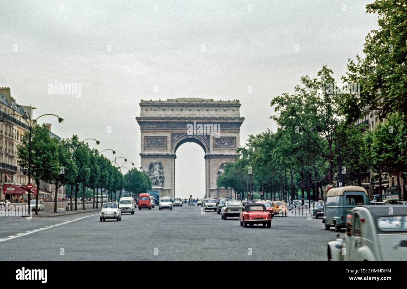 Traffic at the Arc de Triomphe in Paris. Morning commuter traffic.  Archival shot scanned from transparency; 1972. Scanned images may prove a little n Stock Photo