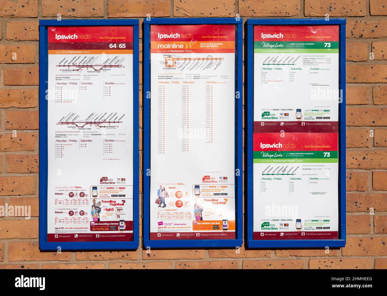 Ipswich Reds bus company service timetable, Martlesham Heath, Suffolk, England, UK - First Eastern Counties Stock Photo