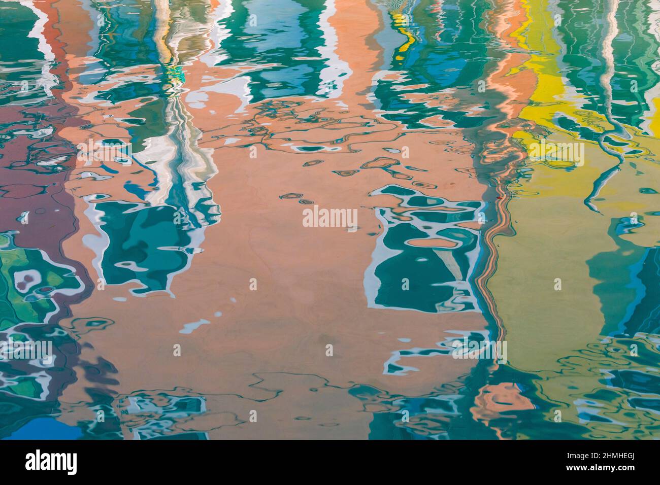 Italy, Veneto, Venice, colorful reflections in the waters of Burano island canals Stock Photo