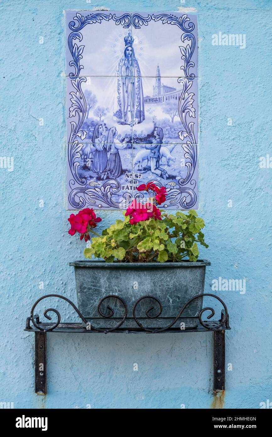 Italy, Veneto, Venice, Our Lady of Fatima, religious symbol on the wall of a house in the island of Burano Stock Photo