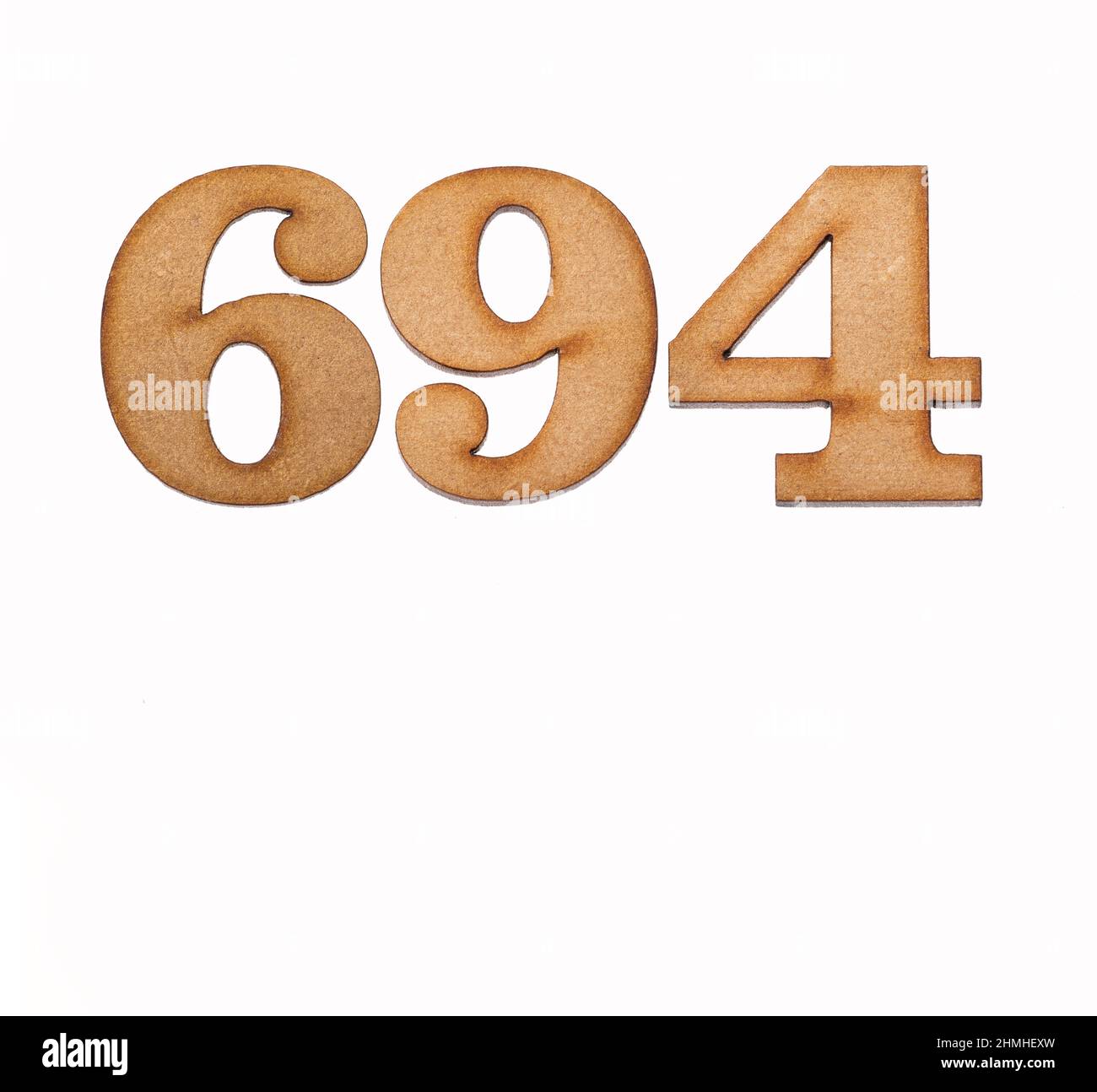 Number 694 - Piece of wood isolated on white background Stock Photo - Alamy