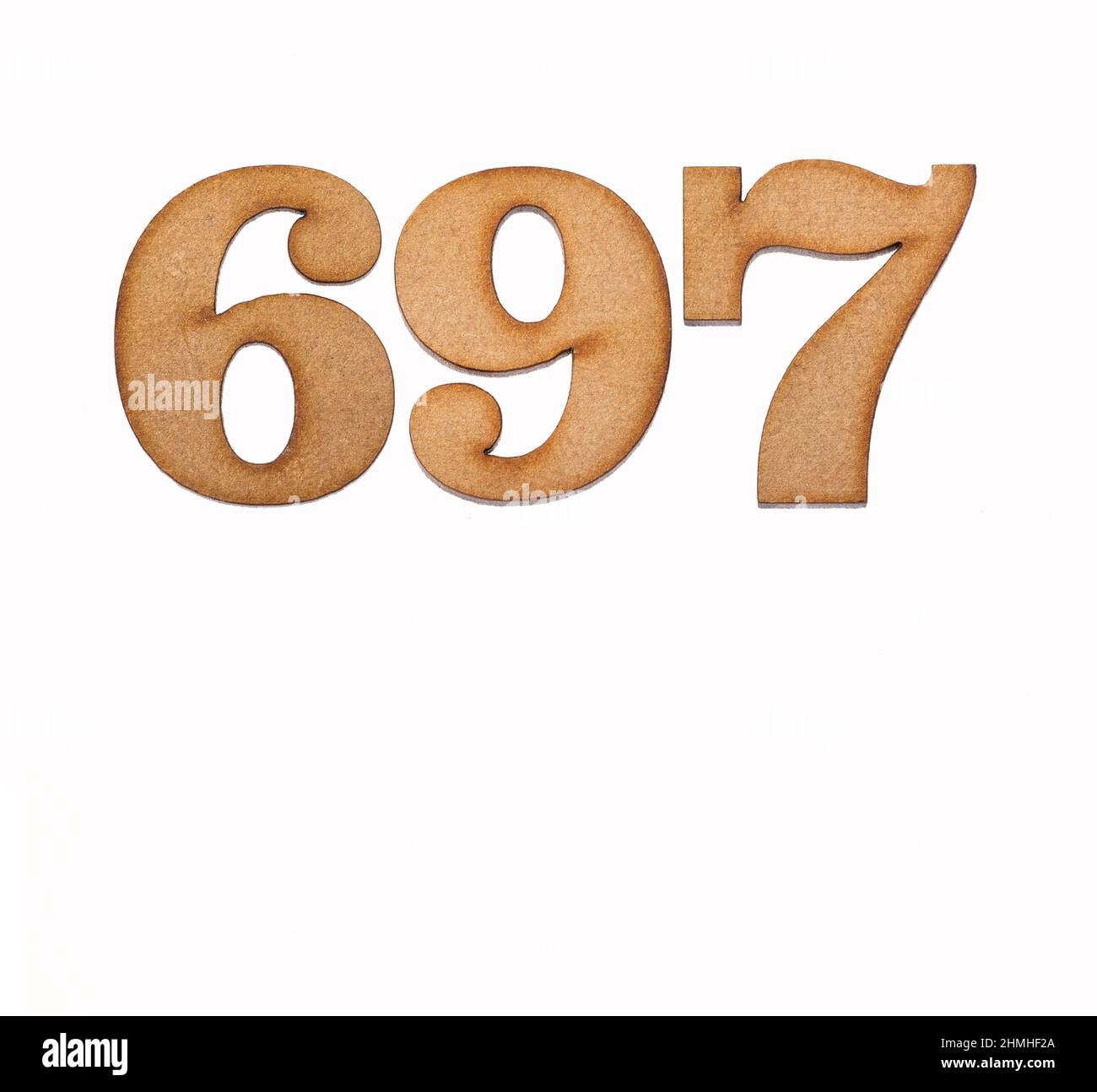 Number 697 in wood, isolated on white background Stock Photo - Alamy