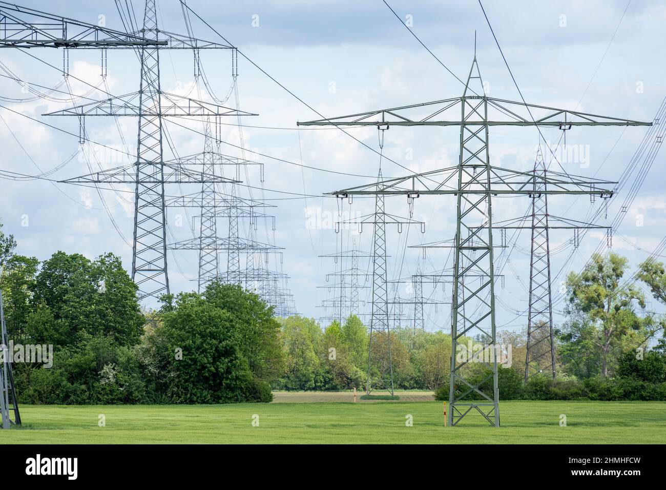 Power lines, power poles in the countryside. Stock Photo