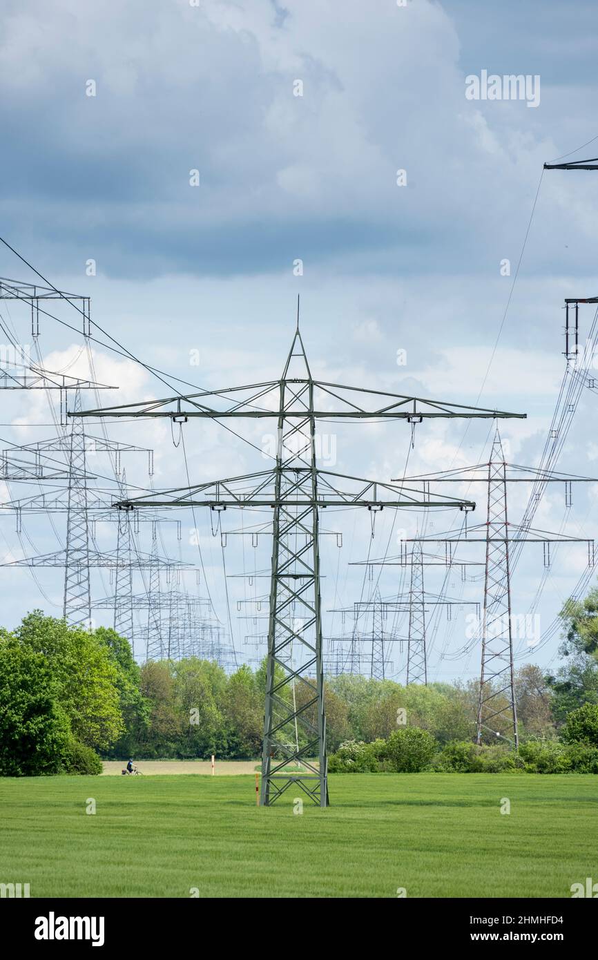 Power lines, power poles in the countryside. Stock Photo