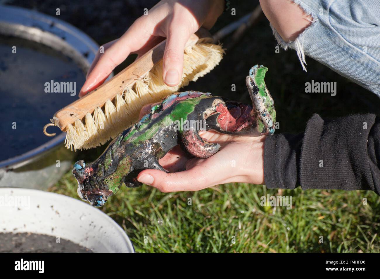 after the raku firing, the objects are freed from the soot Stock Photo