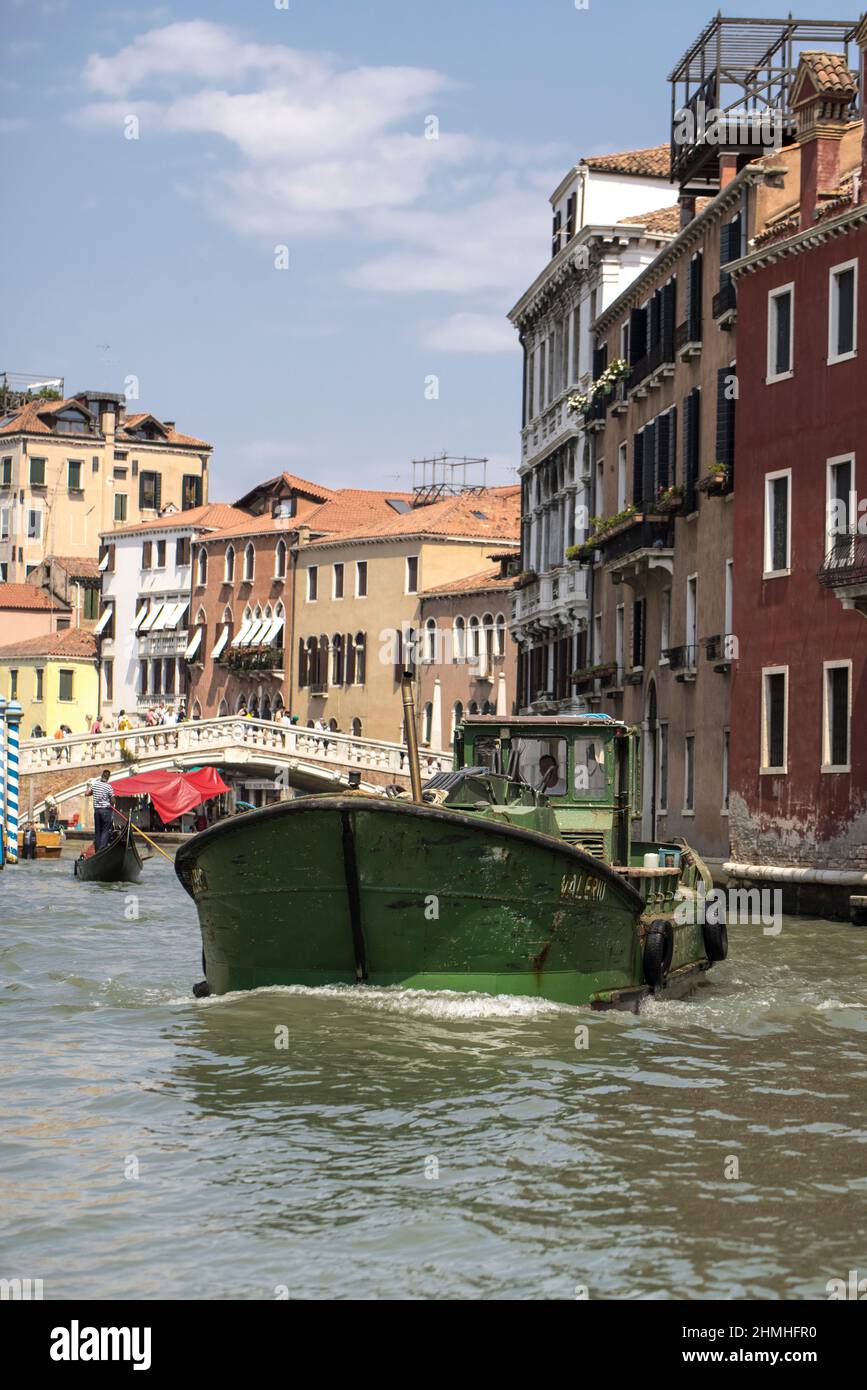 Commercial vehicle on a canal in Venice, Italy Stock Photo